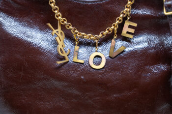 Glazed leather Yves Saint Laurent Tribute tote with gold-tone hardware and a signature "LOVE" charm. - Image 2